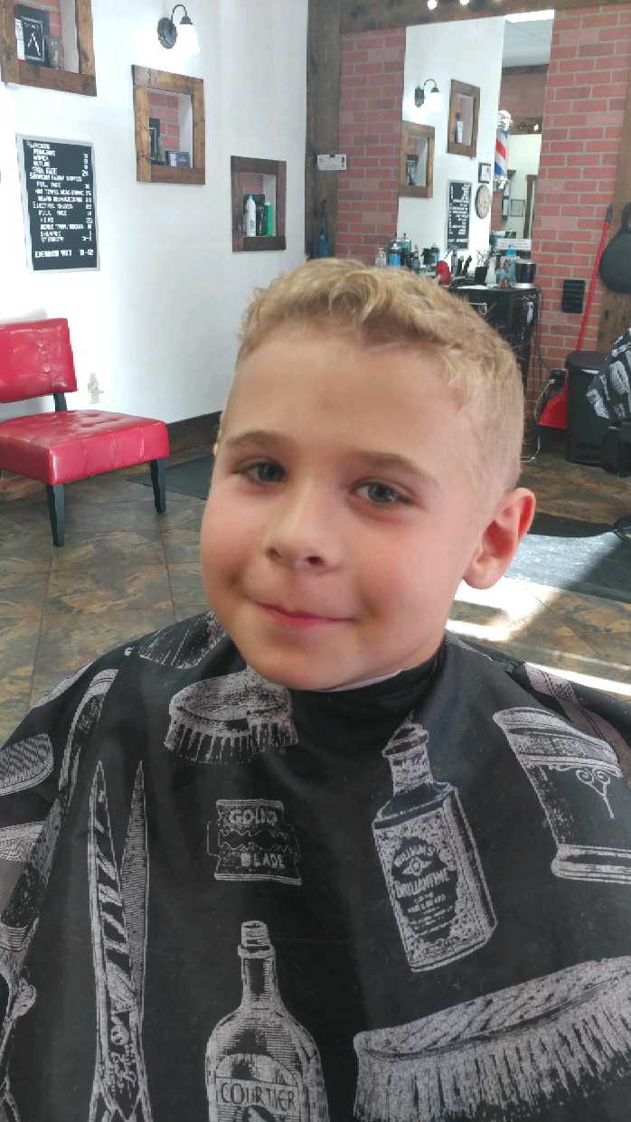 A kid haircut for boys at the Barber Chair in Sarasota